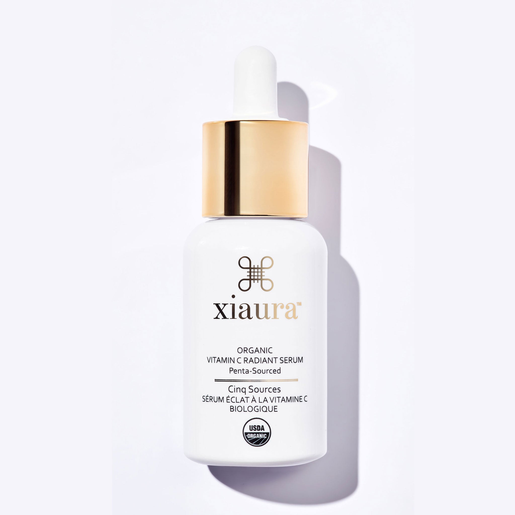 Xiaura organic vitamin C serum bottle on a white background