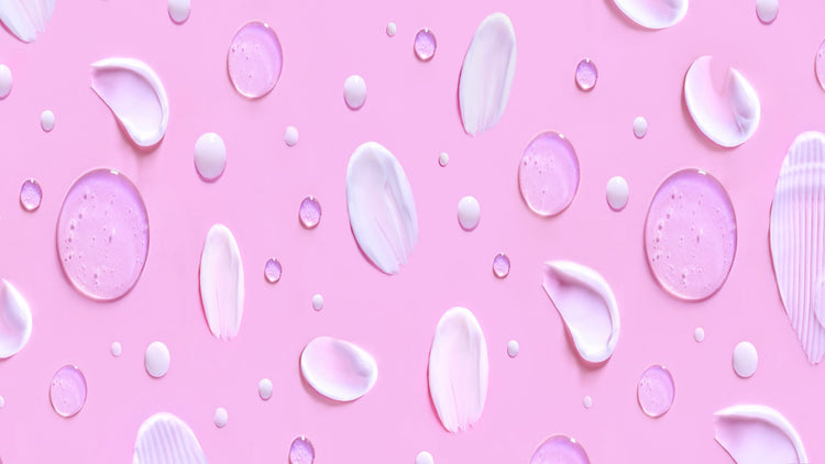 skin care product serum drops and cream patterns in a purple background