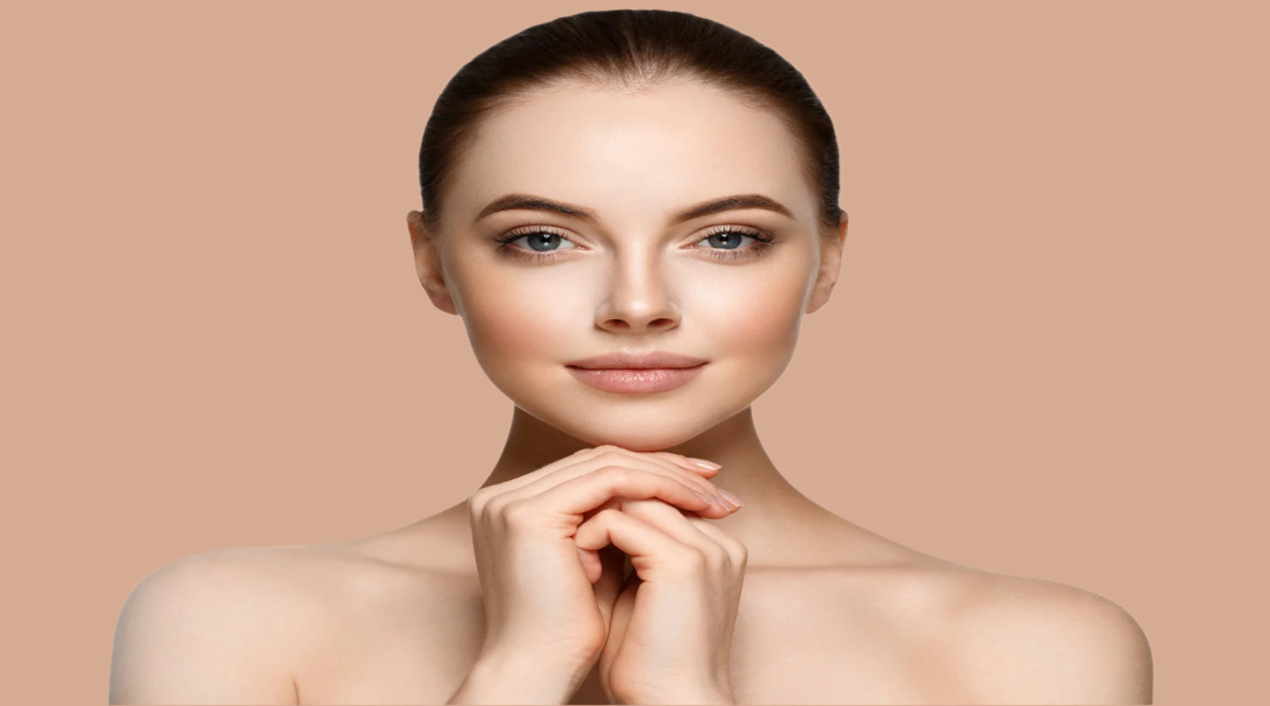 Woman with clear skin on a rose god background